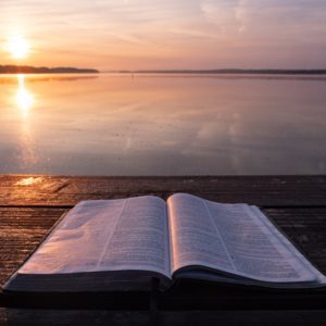 open bible on shore