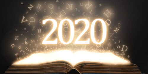 The year 2020 in glowing numbers floats over a glowing bible