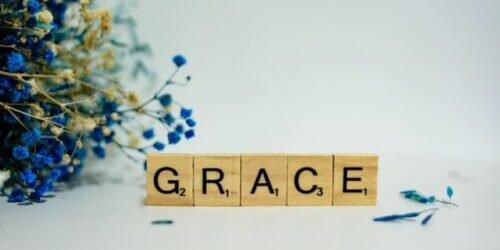 G R A C E is spelled out in Scrabble tiles (Alex Shute, Unsplash)
