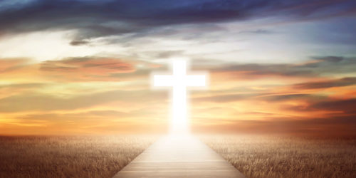 A glowing path leads to a glowing cross, under a turbulent sky
